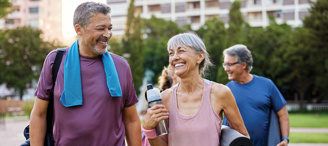 Older couple enjoying a nice afternoon outdoors, representing good spine, neck, and back health